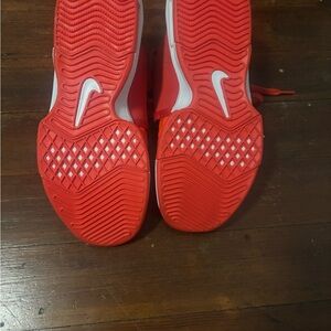Nike Red Sneakers with Chevron Sole Design